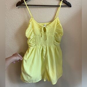 Bright yellow summer romper with pockets
